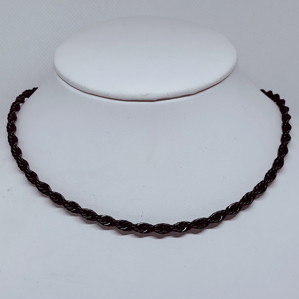 Midnight Steel: 4mm Black Enamel Rope Necklace displayed on a white bust, showcasing its elegant twist design.