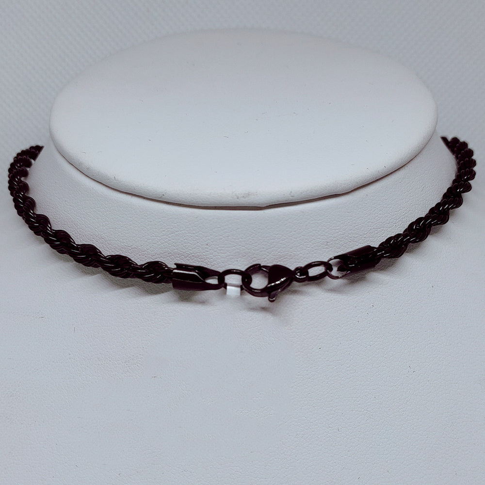 Midnight Steel: 4mm Black Enamel Rope Necklace displayed on a stand, showcasing its durable design and sleek style.