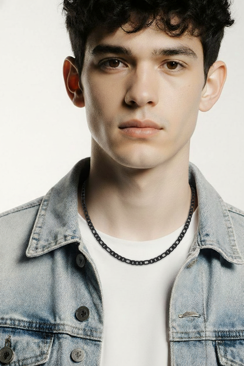 4mm Black Figaro Chain Necklace – Durable Enamel-Coated Stainless Steel worn by a young man with a denim jacket.