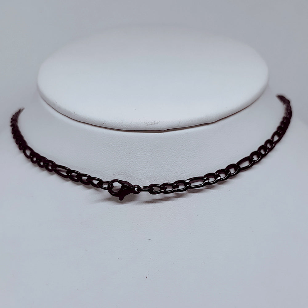 4mm Black Figaro Chain Necklace – Durable Enamel-Coated Stainless Steel on display.